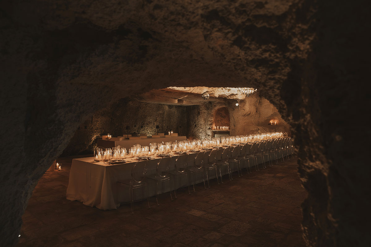 Candlelit cave dining room at Masseria Alchimia